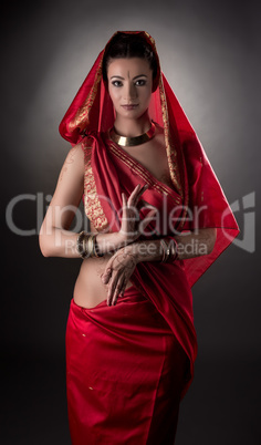 Sensual East woman dressed in sari. Mehndi art
