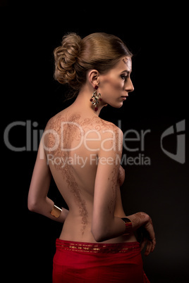 Sexy topless woman with mehndi pattern on her back