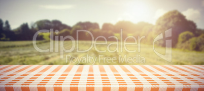 Composite image of orange and white tablecloth