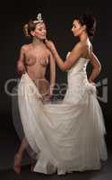 Mehandi art. Shot of sensual brides posing in pair