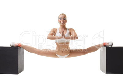Erotic sport. Sexy girl doing gymnastic split
