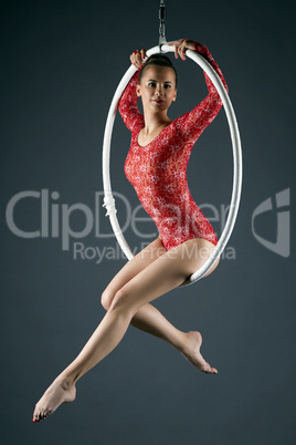 Attractive sexy girl posing on aerial hoop