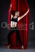 Studio photo of beautiful talented dancer posing