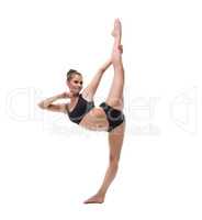 Lovely athlete posing while doing vertical split