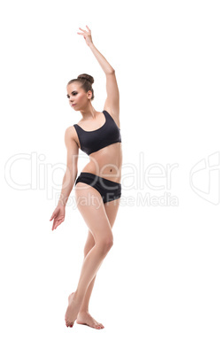 Pretty young gymnast, isolated on white backdrop