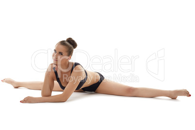 Flexible female gymnast posing looking at camera