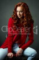Shot of flirty red-haired model in casual clothes