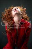 Redhead model posing waving her beautiful hair