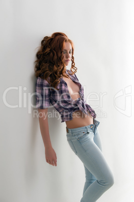 Sexy red-haired woman dressed in casual clothes