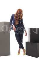 Red-haired model posing in sexy business clothes