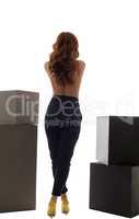 Back view of slim model posing in trendy trousers