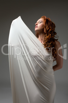 Shot of sexy woman posing wrapped in tight fabric