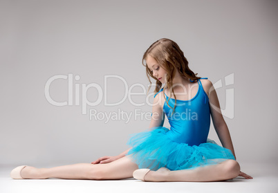 Nice little ballet dancer posing in studio