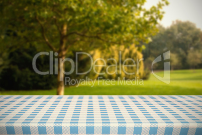 Composite image of part of blue and white tablecloth