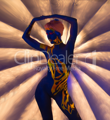 Graceful nude woman posing with glowing patterns