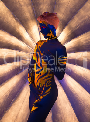 Shot of oriental woman posing nude in UV light
