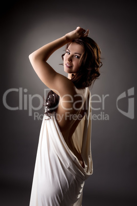 Lovely model posing in loose-fitting dress