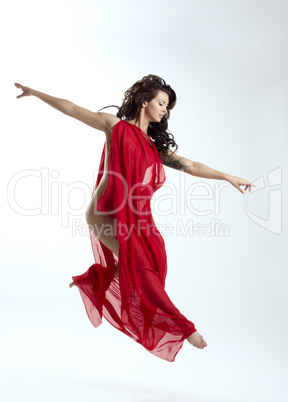 Image of pretty brunette jumping in dance