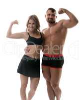 Cheerful handsome athletes showing biceps