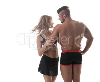 Athletic couple. Muscular man and pretty blonde