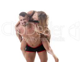 Loving athletic couple fooling around at camera