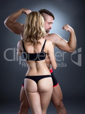 Sexy girls loves bodybuilders. Photo concept