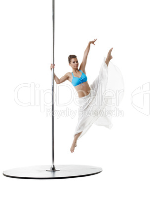 Dancing on pylon. Graceful girl in vertical split