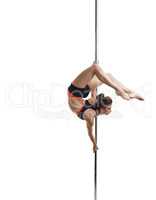 Pole dance. Pretty girl posing gracefully curving