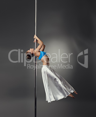 Pole dance. Seductive dancer with perfect body