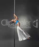 Pole dance. Seductive dancer with perfect body