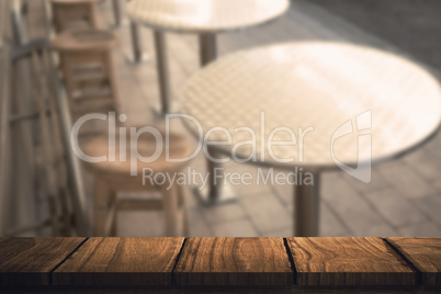 Composite image of wooden desk