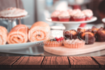 Composite image of wooden desk