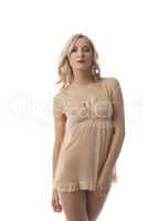 Blonde model posing in translucent negligee