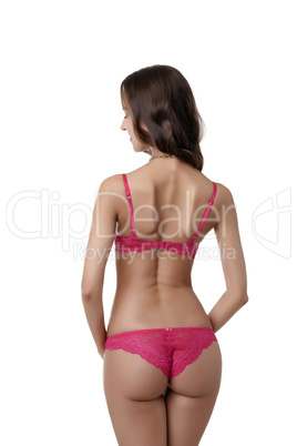 Rear view of slim brunette in sexy pink lingerie