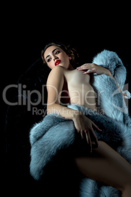 Erotica. Beautiful nude model with luxurious fur