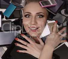 Digital madness. Stunned girl with smartphones