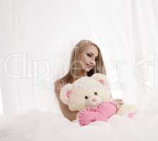 Beauty queen posing with plush teddy bear