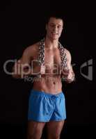 Image of strength athlete posing with chain