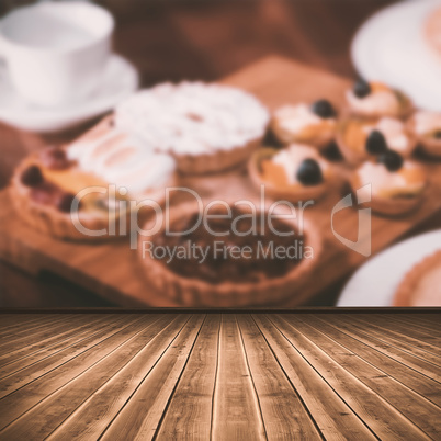 Composite image of high angle view of gray hardwood floor