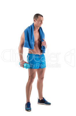 Smiling bodybuilder with shaker and towel