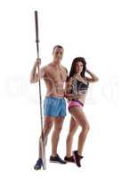 Athletes posing with sports equipment at camera