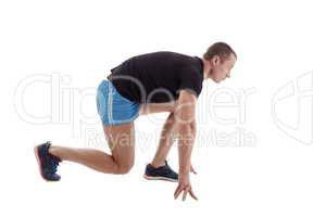 Side view of runner on starting block