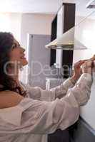 Portrait of beautiful woman in kitchen