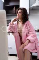 Sexy housewife in bathrobe over her naked body