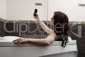 Brunette doing her sexy photo while taking bath