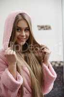 Portrait of smiling model dressed in bathrobe