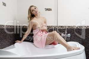 Attractive blonde bared her breasts in bathroom