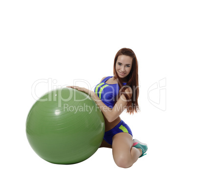 Lovely brunette posing with fitness ball