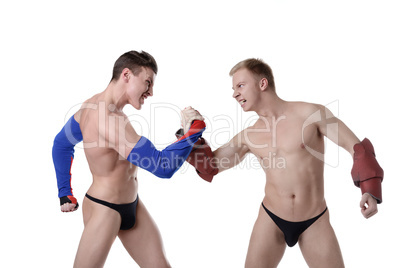 Confrontation of sexy guys dressed as superheroes