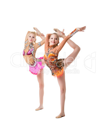Cute gymnasts perform vertical split synchronously